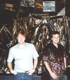 Martin and Dave Cosnette next to a lunar lander